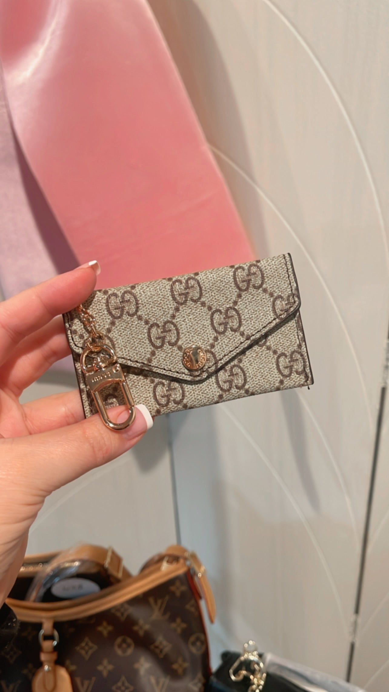 Small taupe keychain wallet