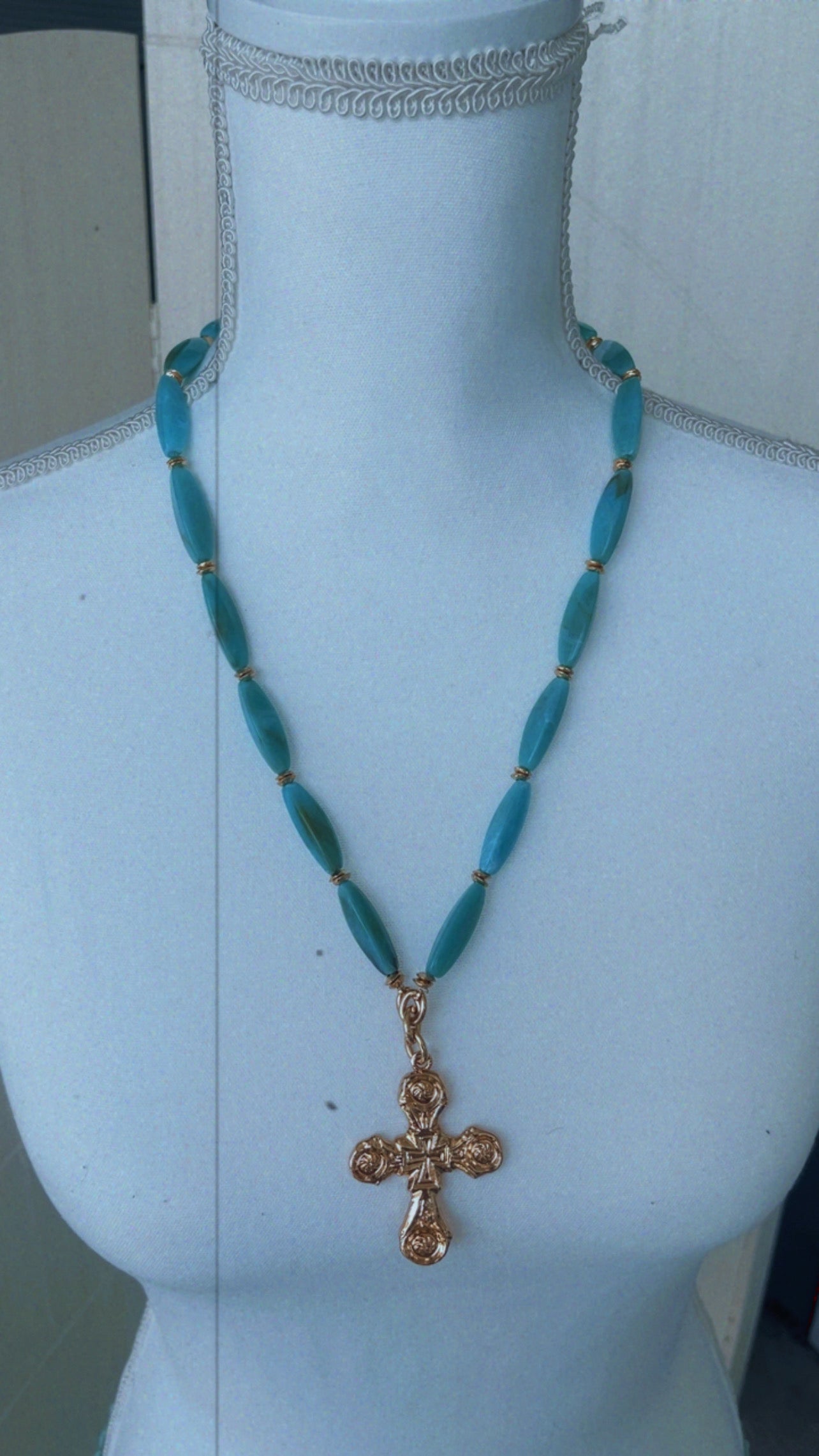 Turquoise statement necklace with cross detail