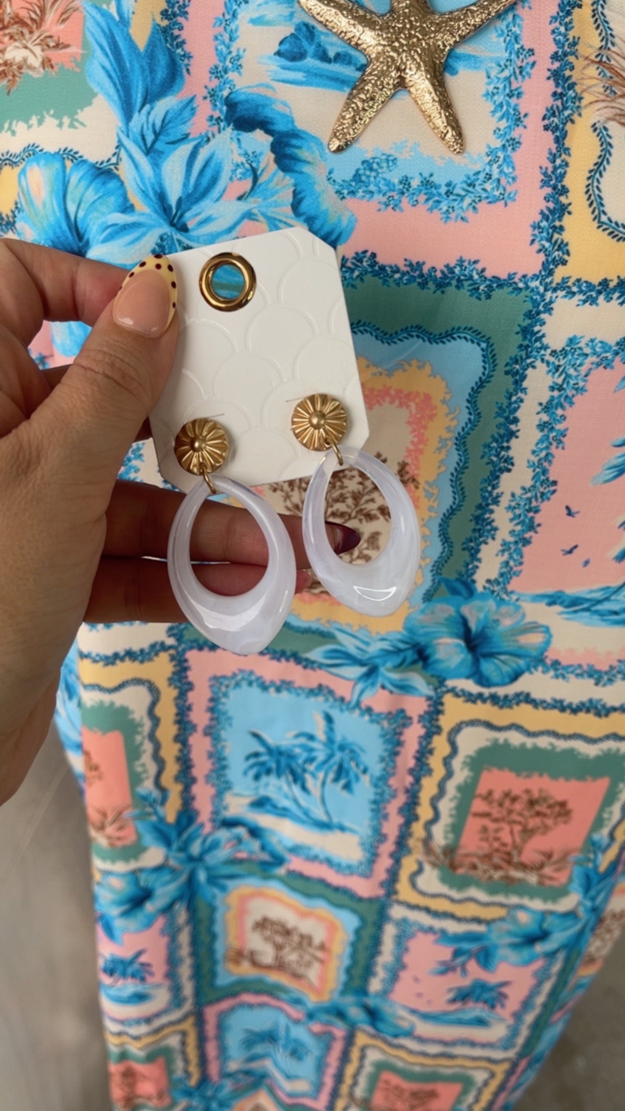 White and gold statement earrings